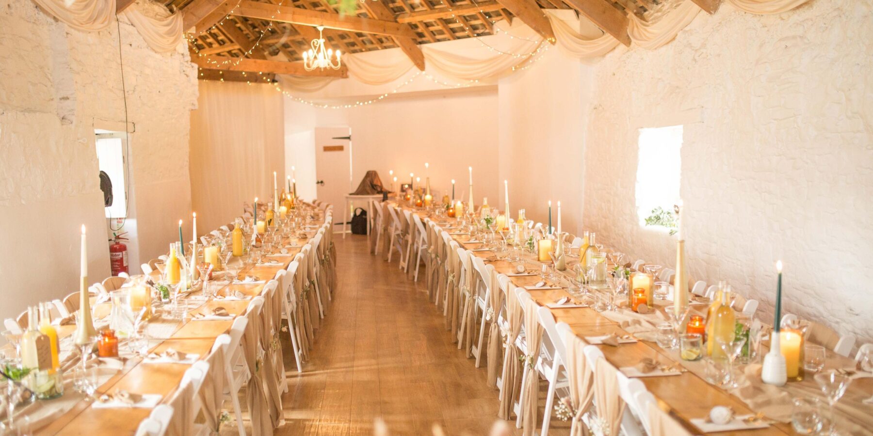 Devon wedding venue beams cream candles